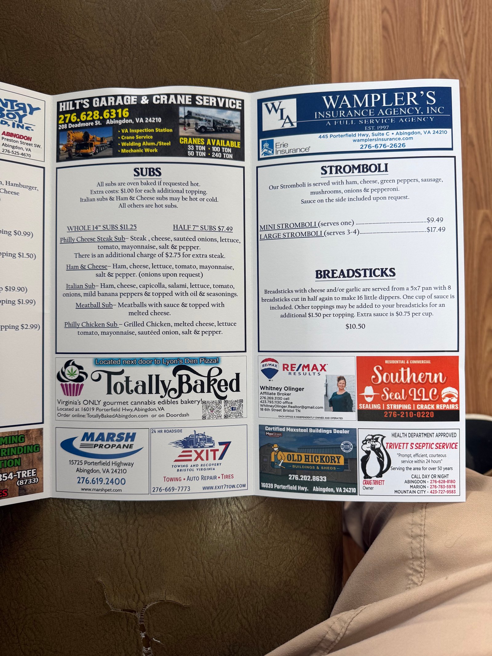 Printed Lyon's Den menu showing subs, stromboli, and breadsticks